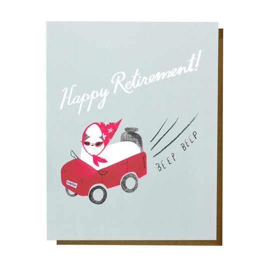 'Happy Retirement!’ card featuring a white dog wearing a red headscarf and sunglasses, driving a small red car with motion lines and the text ‘beep beep’ on a soft blue background.